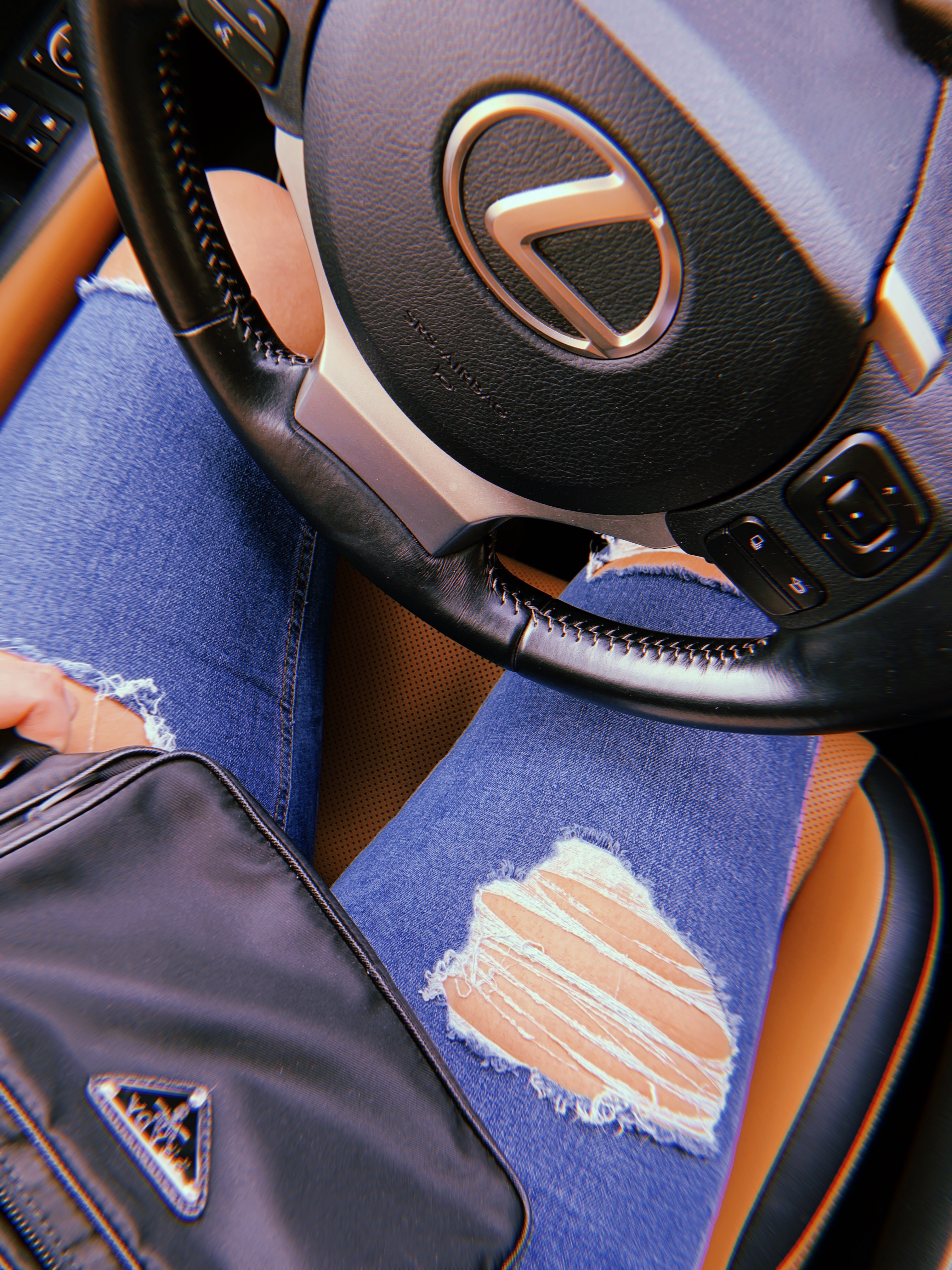 topshop-jeans-lexus-car-steering-wheel-prada-belt-bag